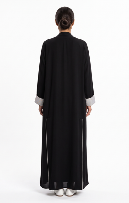 Back view of the black abaya showing the clean silhouette and lined back slit