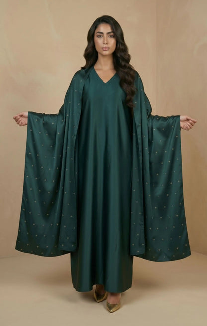 HIRAZ Crafted from luxurious crepe silk, it features a soft, flowing drape  delicate hand embroidery in gold an attached shawl extends from the garment