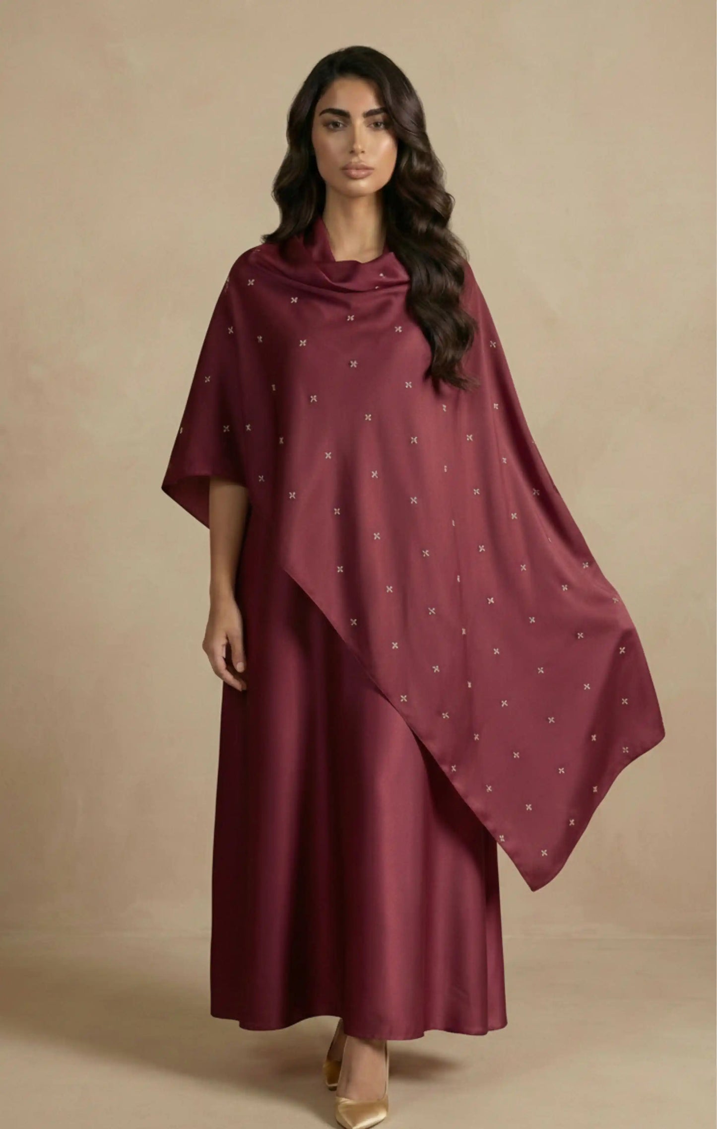 Sudla abaya in luxurious crepe silk, it features a soft, flowing drape delicate hand embroidery in gold,