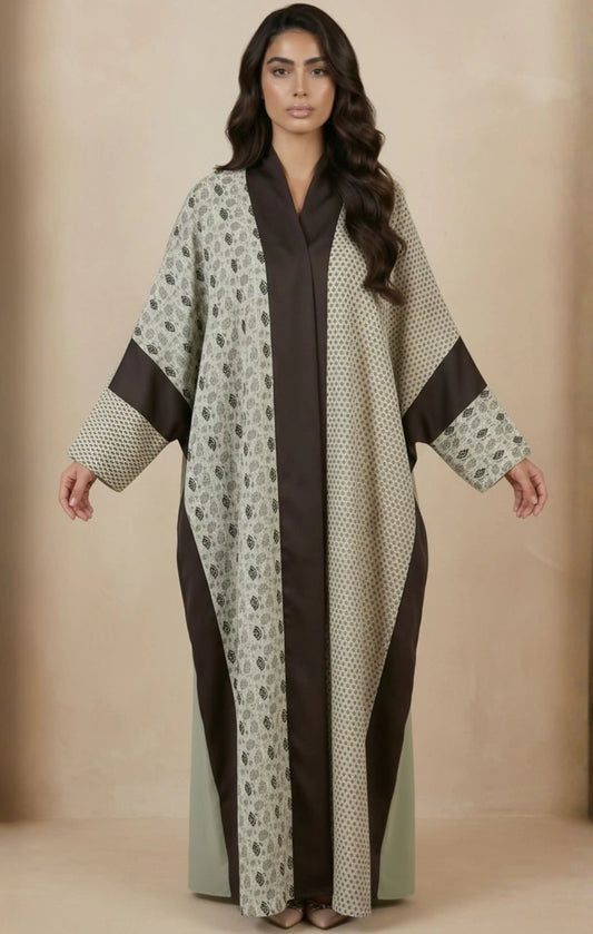 Two-piece modest abaya with a patterned cotton-silk front panel featuring vertical detailing, worn over a solid-color inner dress.