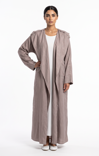 Light pink trench-lapel abaya in linen-viscose blend, full length front view, designed for everyday outerwear in Jeddah Saudi Arabia