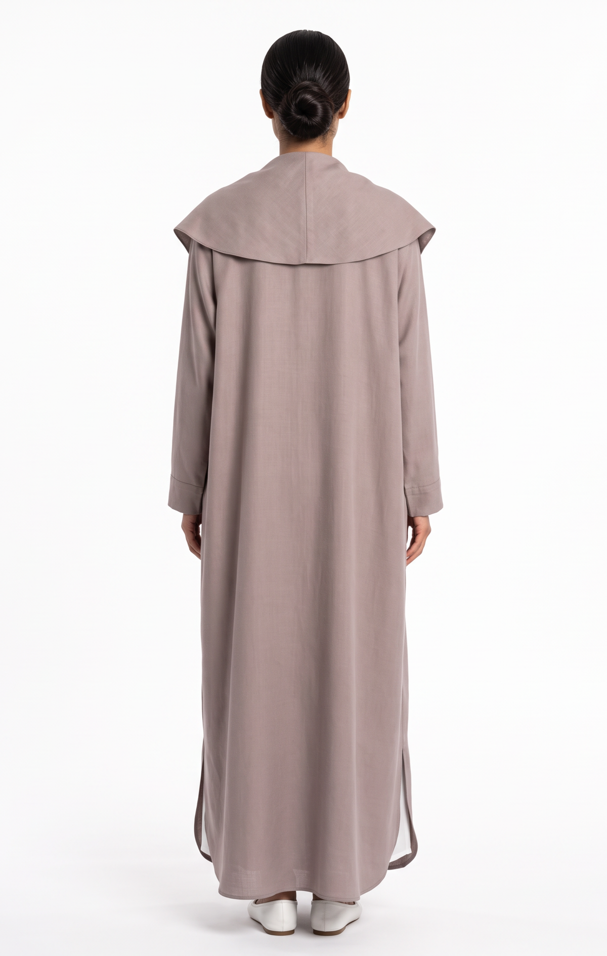 Back view of women's taupe trench abaya featuring storm-flap collar overlay and side hem slits